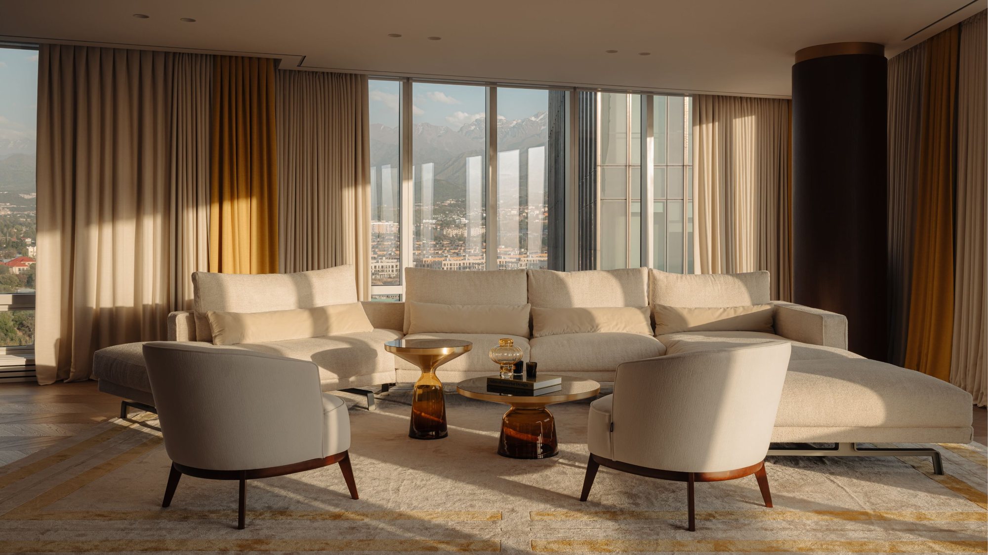 Elegant luxury living room with floor-to-ceiling windows and designer furnishings